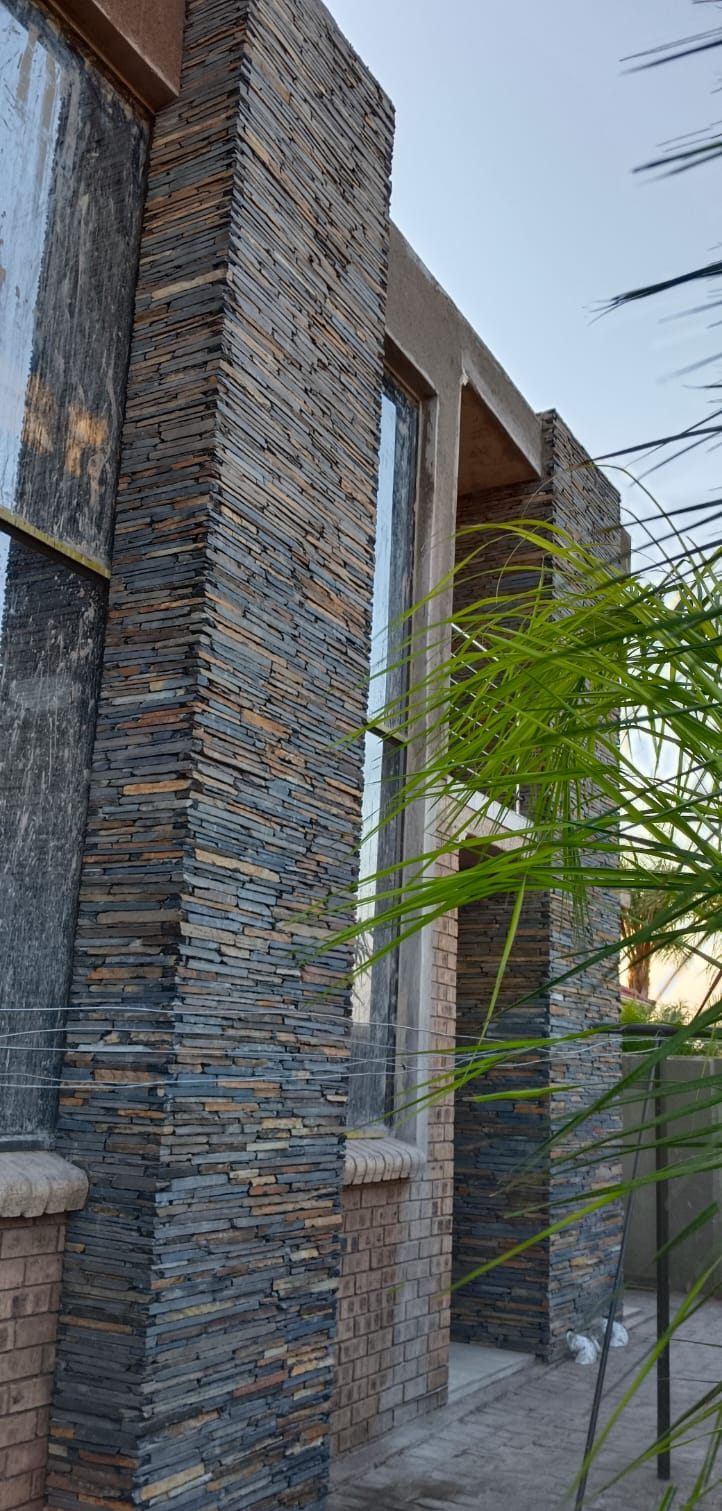 Tall slate-clad facade pillars