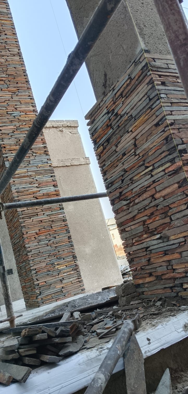 Upper floor pillars being clad