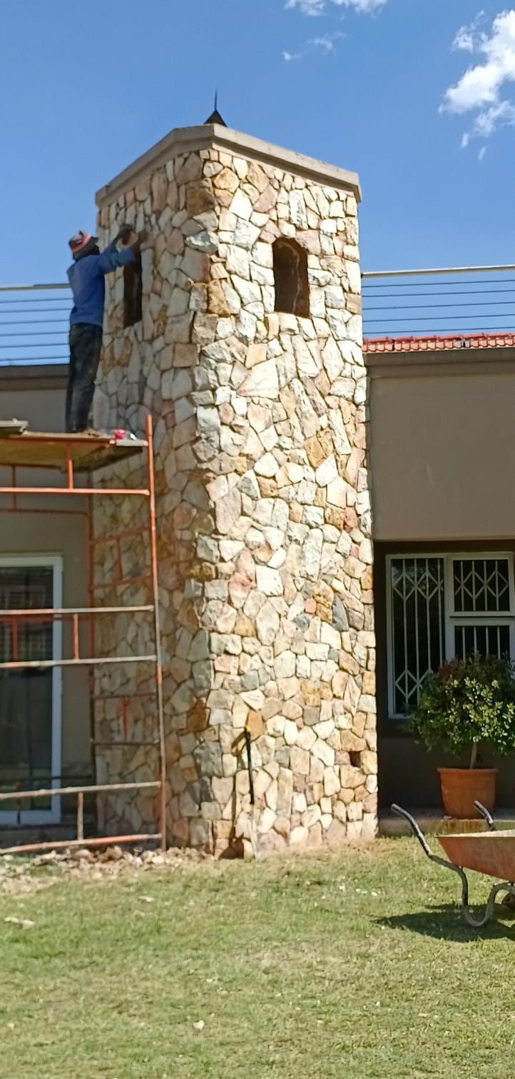 Sandstone tower being clad